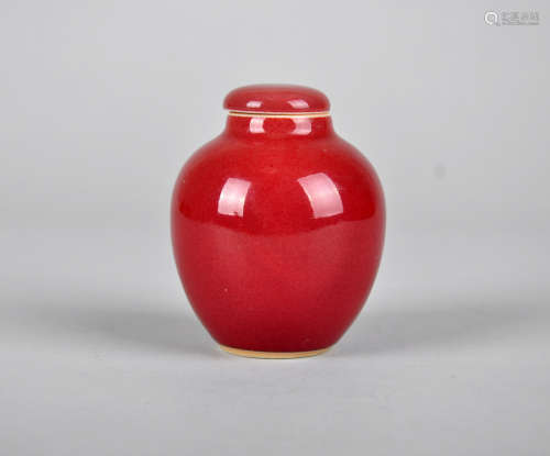 Chinese ox blood porcelain jar with lid.