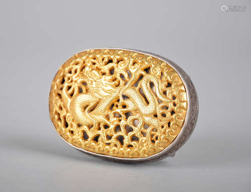 Gilted silver belt buckle with dragon decoration.