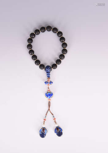 A Chinese dark wood beads bracelet.