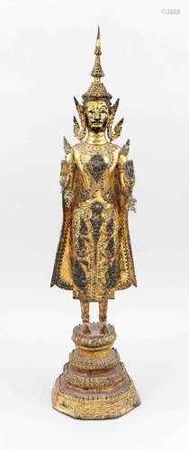 A Thai Buddha Rattanakosin around 1900, bronze richly gilt, on stepped octagon foot with rounded edges, lotus base, Buddha Shakyamuni with raised hands (with small, pierced pendentives), softly worn, the coat verso chipped, dark dicolourations, h. 59 cm