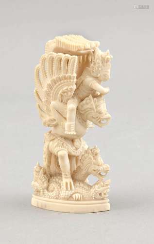 An Indonesian Garuda, 1st quarter 20th c., a small, delicately carved ivory figure of Garuda with a rider ready for battle above 2 dragon-like creatures, small base, h. 12 cm