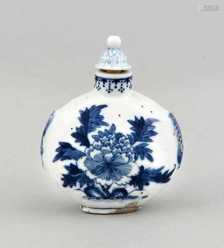 A 19th-century Chinese snuffbottle, painted with flowers in underglaze cobaltblue, the cover presumably added later, h. 8 cm