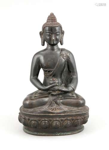 A 19th-century Tibetan Buddha Padmasana holding a censer, bronze patinated black, the bottom plate chased with Varja ornament, h. 21 cm