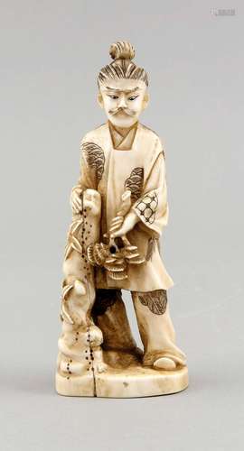 A 19th-century Japanese okimono, ivory carved, with blackened engravings, man leaning on rock holding a pine twig, h. 15 cm