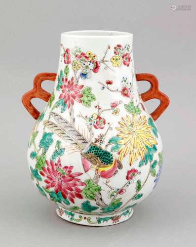 A Chinese vase, 1st half 20th c., of Hu form, polychromed with flowers and birds, the handles with two holes, stamped Tongzhi mark in red, h. 27 cm