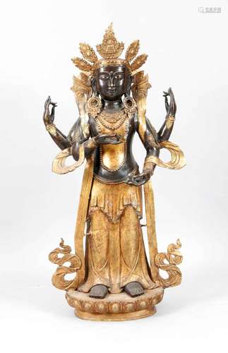 Large bronze of a Guanyin?, Tibet, 20th c., partly uncoated, partly dark patinated, on lotus-base, h. 117 cm