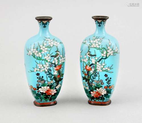 A pair of small cloisonné vases, Japan/China around 1900, decorated with a small flushing prunus (?) tree, birds and flowers on seladon ground, h. 12 cm