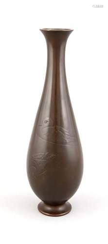 A Japanese bronze vase with duck decor, 1st half 20th c., of drop form on circular foot, delicate relief depicting ducks on water, engraved with signature, h. 36 cm