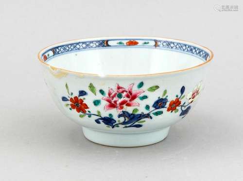 A small 19th-century Chinese bowl, the side continuously polychromed with flowers, the center with single flower (worn), the interior border surrounded with flower cartouches, restored and chipped, h. 7/ d. 14 cm