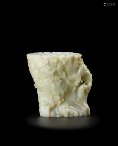 18th/19th century A magnificent large pale greenish-white jade 'prunus' trunk-form brush pot