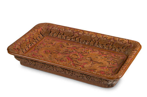 Wanli mark cyclically dated Renchen year, corresponding to 1592 and of the period An exceptionally rare Imperial carved yellow and red lacquer 'dragon' tray