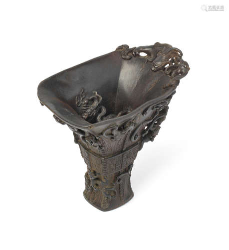 18th century A rare and large rhinoceros horn archaistic 'sixteen-dragon' libation cup