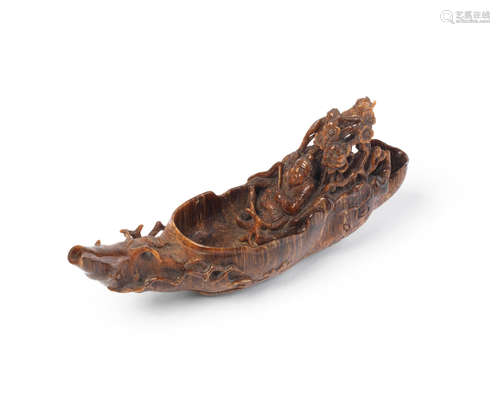 17th/18th century A rare small rhinoceros horn 'Zhang Qian in a Raft' pouring vessel