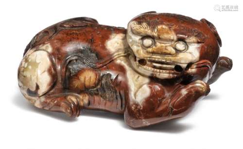 A Chinese carved soapstone Buddhist-lion scroll weight. Qing 18th-19th century. L. 8 cm.