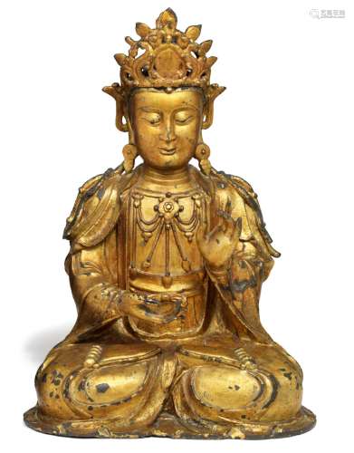 A large Chinese lacquer gilt bronze figure of a Guanyin seated in dhyanasana. Ming, late 16th century. Weight c. 17200 g. H. 52 cm.
