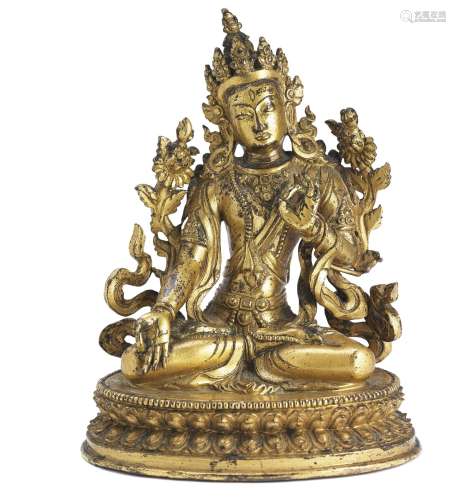 A Chinese gilt bronze figure of White Tara. Sealed bottom. Qianlong 1736–1795. Weight 780 g. H. 12 cm.