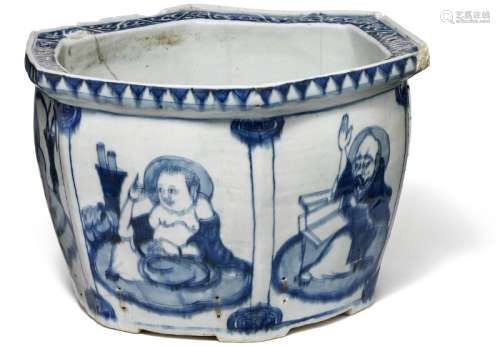 A Chinese six-sidede porcelain flower pot decorated in underglaze blue with Buddhist figures in fields. Ming  1368–1644. H. 21.5 cm. Diam. 35.5 cm.