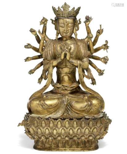 A Chinese 18-armed gilt bronze figure of Avalokitesvara. Ming 1368–1644. H. with throne c. 67 cm.