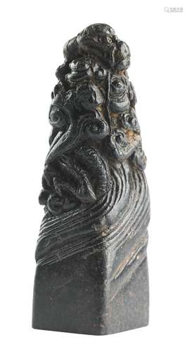 A black soap stone seal carved with dragon and signature. Qing 18th-19th century. H. 6 cm.