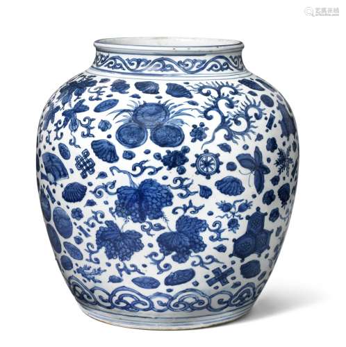 A large Chinese blue and white porcelain jar decorated with foliage and various objects, below with ruyi border. Ming 1368–1644. H. 34 cm.