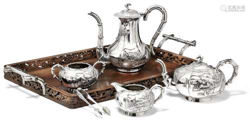 A Chinese export silver tea set and wooden tray with silver mountings. C. 1900. (6)