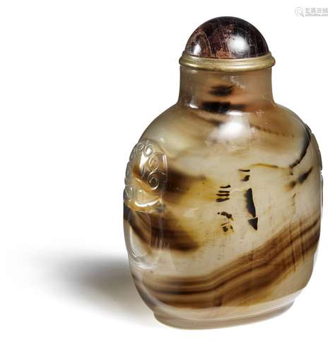 A large Chinese brownish agate snuff bottle, rectangular form, shoulders carved with mask and handles. Qing. H. 9 cm.