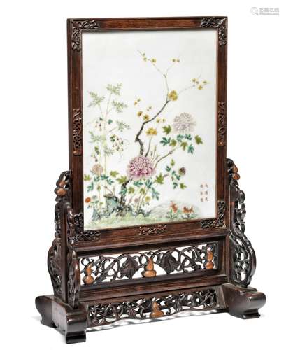 A Chinese tablescreen with porcelain plaque decorated with flowers. Marked Guangxu and of the period.