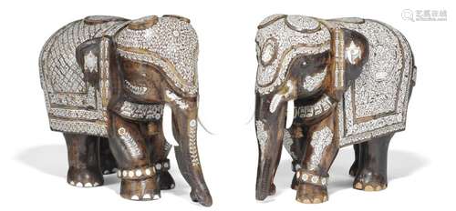 An Anglo-Indian wood and ivory elephant couple. Circa 1890–1919. (2)