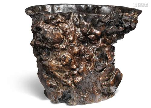 A large burlwood brushpot. Qing 1644–1912.  H. 19 cm. Diam 24.5×15.5 cm.