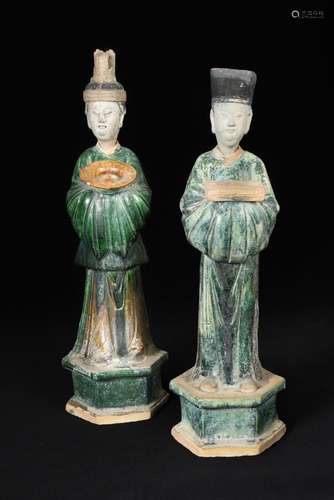 A pair of Ming dynasty attendants with removable heads, each standing on a hexagonal plinth, the