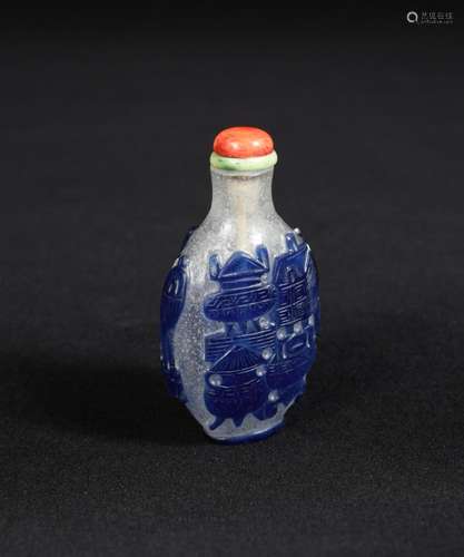 A 19th century glass overlay snuff bottle, carved with blue overlay 'antiques' on both sides, 7cm