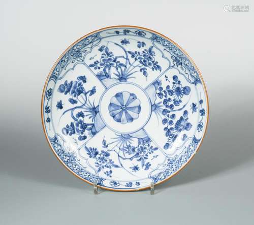 A Kangxi dish, the central rosette enclosed by four radiating panels of gardens, 27cm diameter