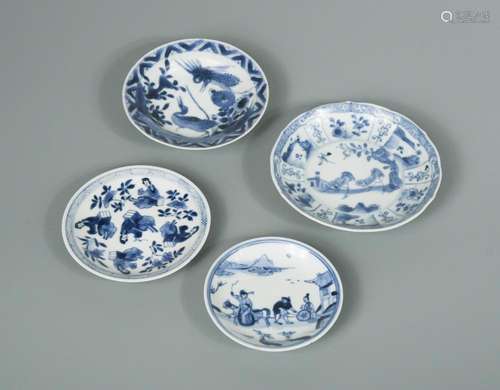 Four saucers from Kangxi period, the first painted with two chickens within radiating panels, 11.5cm