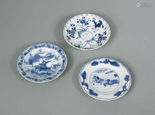 Three Kangxi period small dishes, one painted with two horse-borne figures within three sprays of