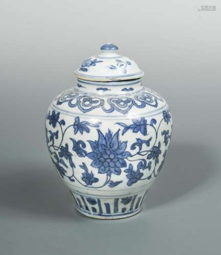 A Ming blue and white covered ovoid jar, with scrolling lotus band below ruyi lappets on the