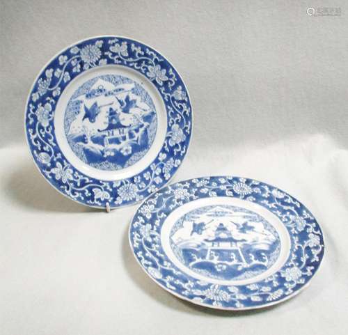 An pair of almost similar Kangxi plates with pagoda, painted with two cranes flying over an island