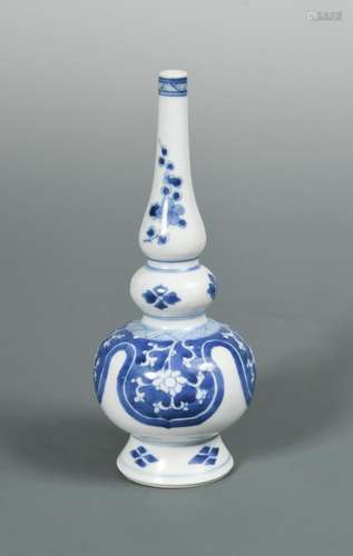 A blue and white Kangxi gourd shaped vase, painted with lappets and flowers, 17.5cm high