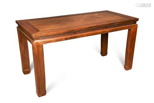 An 18th century style Chinese hardwood table, with a rectangular top above a scroll carved and