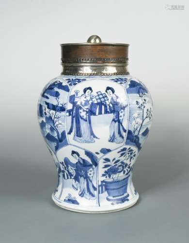 A silver mounted Kangxi baluster jar with wood cover, painted with alternating panels of figures,