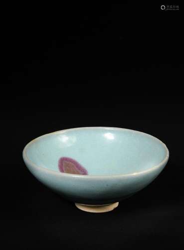 A large Junyao bowl, Yuan dynasty, covered overall with a milky lavender glaze, with a reddish