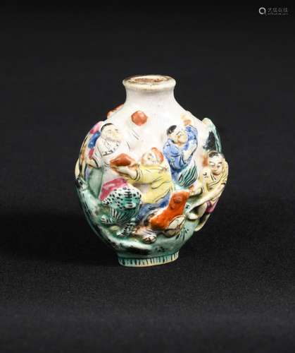 A 19th century moulded snuff bottle, moulded and coloured in famille rose enamels, a red clothed