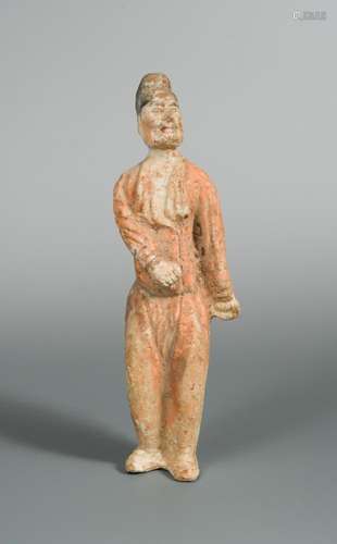 A Tang dynasty terracotta man servant, with traces of polychrome decoration, 31cm high Wear and