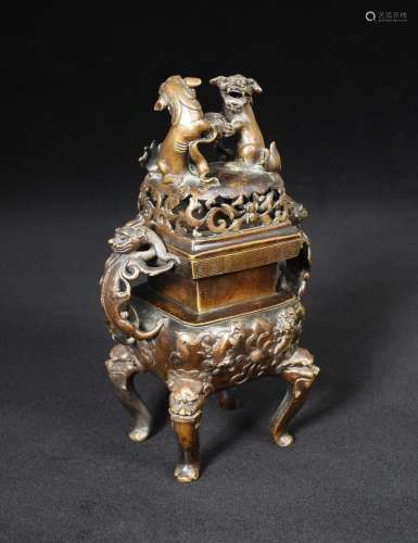 A Chinese square bronze censer, late Ming dynasty, with two dragon handles flanking the square