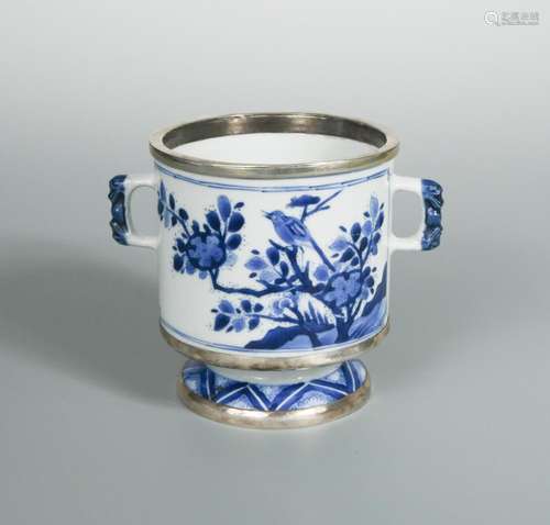 A Kangxi blue and white silver mounted two handled cylindrical jar, painted on one side with a