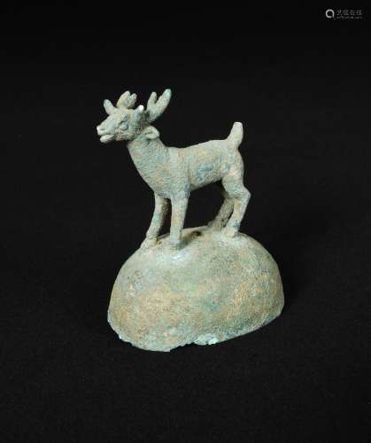 A Dongson bronze ornament, Vietnam or Cambodia , 2nd-1st century BC, the top of the fitting set with