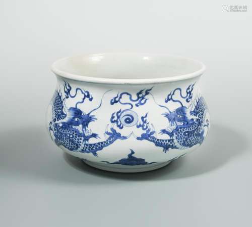 A Kangxi bowl, painted with two dragons head to head with sacred pearl, 22cm diameter Some