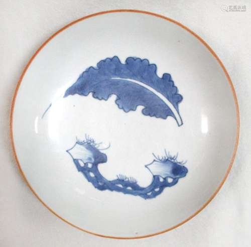 A transitional dish, painted with an artemesia leaf and a rock to form a roundel, 21cm diameter