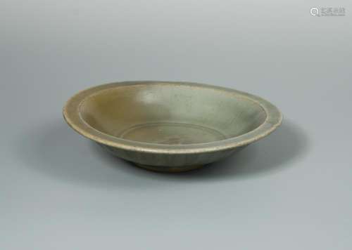 A Song dynasty Longquan 'Twin Fish' dish decorated to the interior with a pair of scaly fish moulded