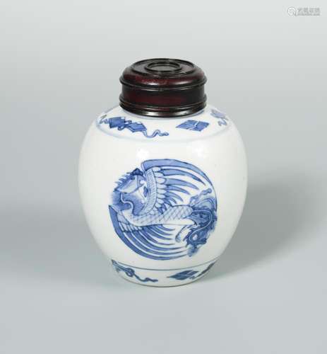 A Kangxi ovoid jar and wood cover painted with three phoenix roundels, 13cm high (2)