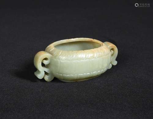 A 19th century jade lotus flower brush washer, the sea green stone with brown tints about the rim